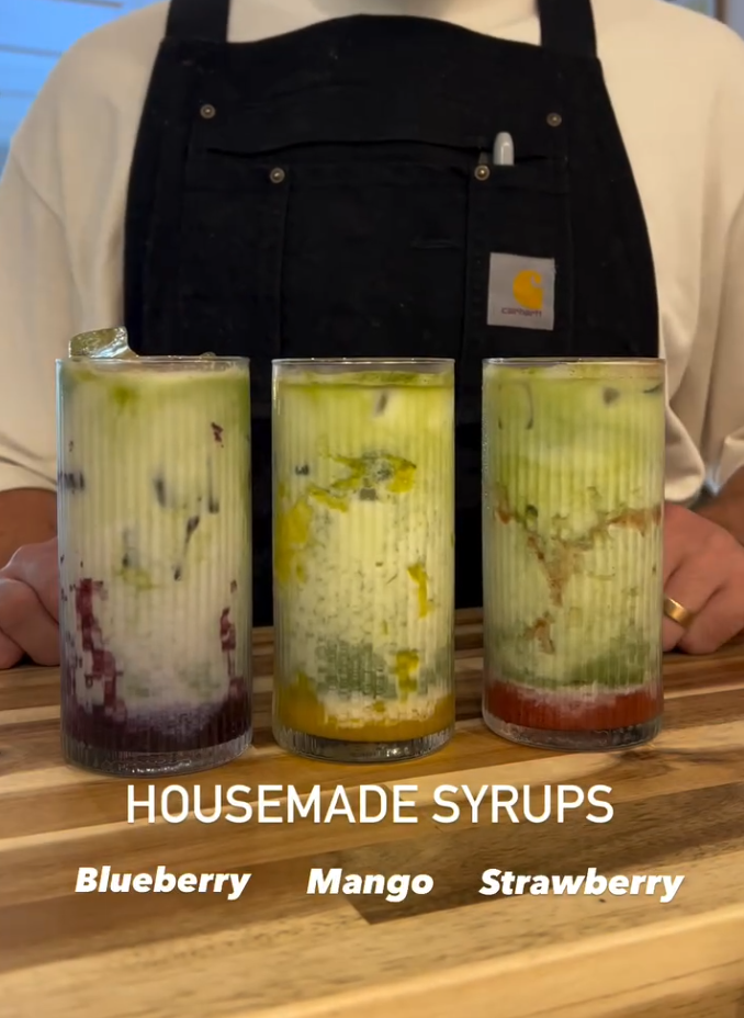 Three jars of house-made syrups — blueberry, mango and strawberry