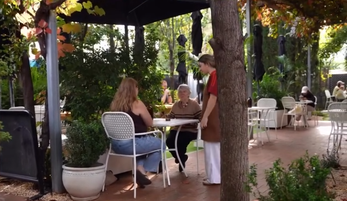 Customers relaxing in the courtyard garden